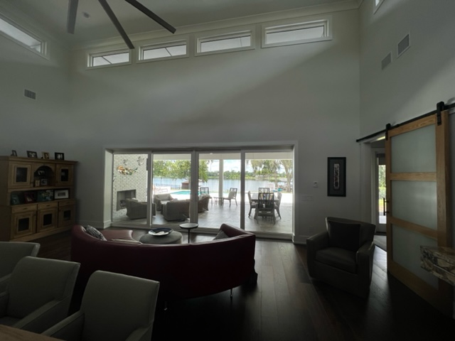 Impact Windows – Coastal Home Impact windows on a coastal Florida property by Storm Protection Pros